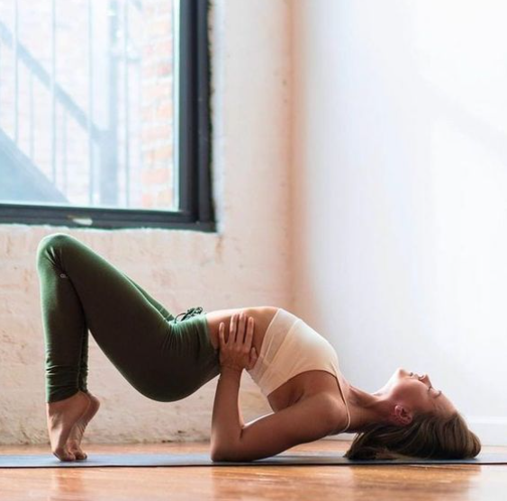Practitioner lengthening into a glow-inducing hot yoga pose
